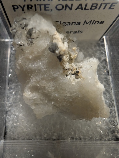 Fairfieldite, Pyrite, on Albite